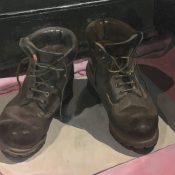 A still life of tattered painter's boots.